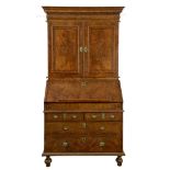 A George I walnut bureau bookcase, circa 1720, moulded cornice  A George I walnut bureau bookcase,