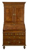 A George I walnut bureau bookcase, circa 1720, moulded cornice  A George I walnut bureau bookcase,