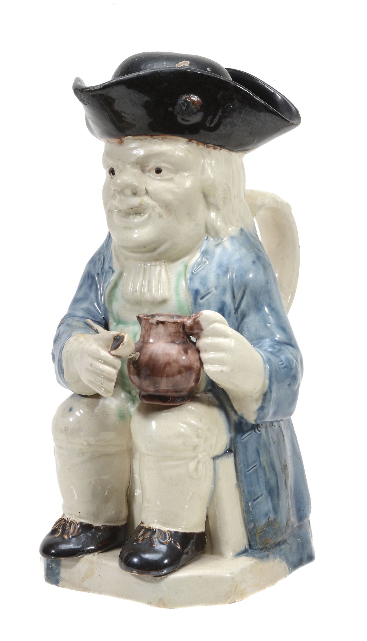 A pearlware Toby jug of so-called 'step' or 'Twyford' type, circa 1780  A pearlware Toby jug of so-
