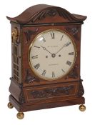 A William IV brass inlaid carved mahogany bracket clock The dial inscribed...  A William IV brass