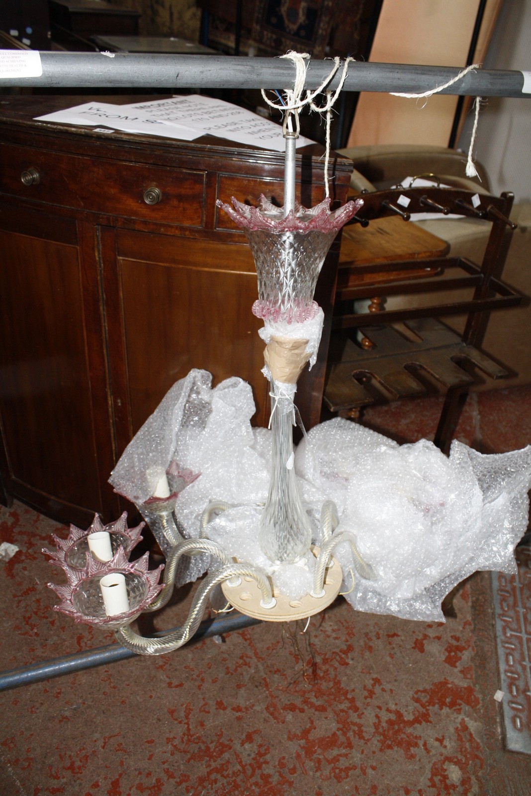 A Venetian modern clear and pink tinted glass six light chandelier, the electrical fitments in