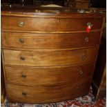 A Regency mahogany bowfront chest with five graduated drawers.