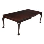 A mahogany extending dining table, George III style, 20th century the rectangular top with rounded