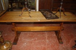 An oak refectory table with trestle supports 182cm length