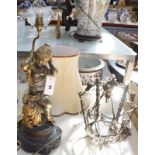 A 20th Century figural table lamp, of a young girl on a scroll base, with cream shade (sold as