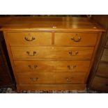 A walnut Edwardian chest of two short and three long drawers.