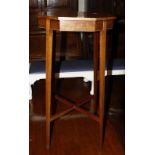 An Edwardian mahogany and satinwood banded octagonal two-tier table.