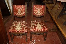 A pair of carved oak dining chairs in Tudor style, a pair of Edwardian salon chairs and a George III