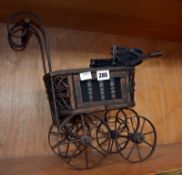 A Victorian style toy pram.Best Bid