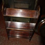 An Edwardian oval mirror and another similar, a mahogany standing book trough (3)Best Bid