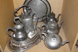 A quantity of pewter items to include assorted teapots, a circular tray and silver plated trays Best