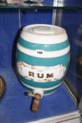 A 19th Century pottery rum barrel, 32cm high (AF)