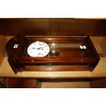 A 20th Century mahogany cased wall clock by Comitti of London (with key), 60cm long approx.