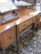 A George IV mahogany breakfront sideboard, with one central drawer flanked by two deep drawers on