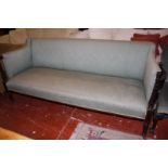 A George IV mahogany green upholstered sofa with reeded arm supports on reeded legs 194cm length