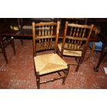 A set of seven 'Lancashire' oak spindle back chairs to include two armchairs
