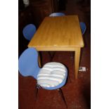 A kitchen table 122cm length and a set of four chairs