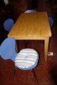 A kitchen table 122cm length and a set of four chairs