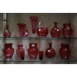 A quantity of cranberry glassware to include jugs, tumblers, vases etc -14