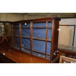 A mahogany hanging cabinet, 19th century, with astragal glazed doors 61cm high, 111cm wide