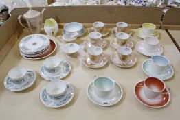 A Susie Cooper part teaset, five cups and saucers, six plates, sugar bowl and milk jug, a