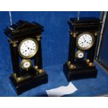 A 19th Century French ebonised and ormolu mounted portico mantel clock, the white enamel dial within