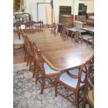 * A Regency style mahogany twin pedestal crossbanded dining table with three additional leaves 320cm