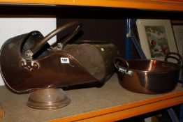 A copper helmet shaped coal scuttle, a copper preserving pan and a brass bowl