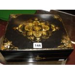 A 19th Century Jennens & Bettridge papier mache inlaid sewing box, 28cm wide