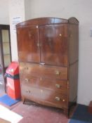 A Regency mahogany secretaire cabinet, the upper section enclosing shelves with two short and two