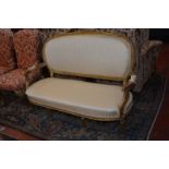 A Louis XVI style giltwood sofa