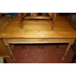 A pine kitchen table with drawers 121cm length