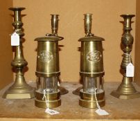 Two miner's lamps both with Welsh Dragon and 'Cymru', a pair of brass spiral twist candlesticks