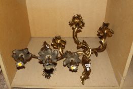 A pair of gilt metal three branch wall lights in Louis XV style, 41cm long