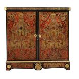 A `Boulle' marquetry side cabinet  , mid 19th century,  the pair of doors inlaid in cut brass and