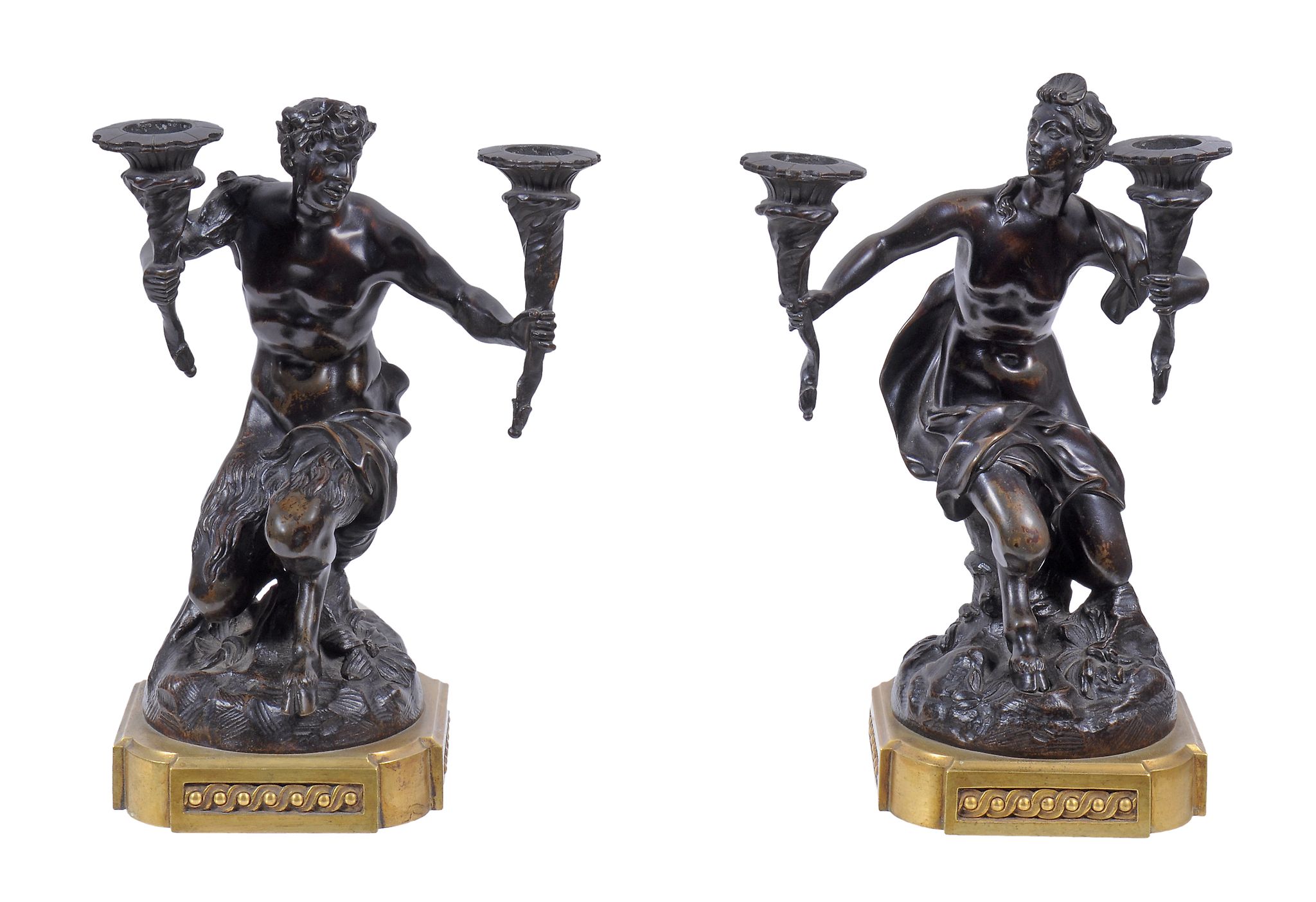 A pair of Continental patinated and gilt bronze mounted twin light figural candelabra,   mid 19th