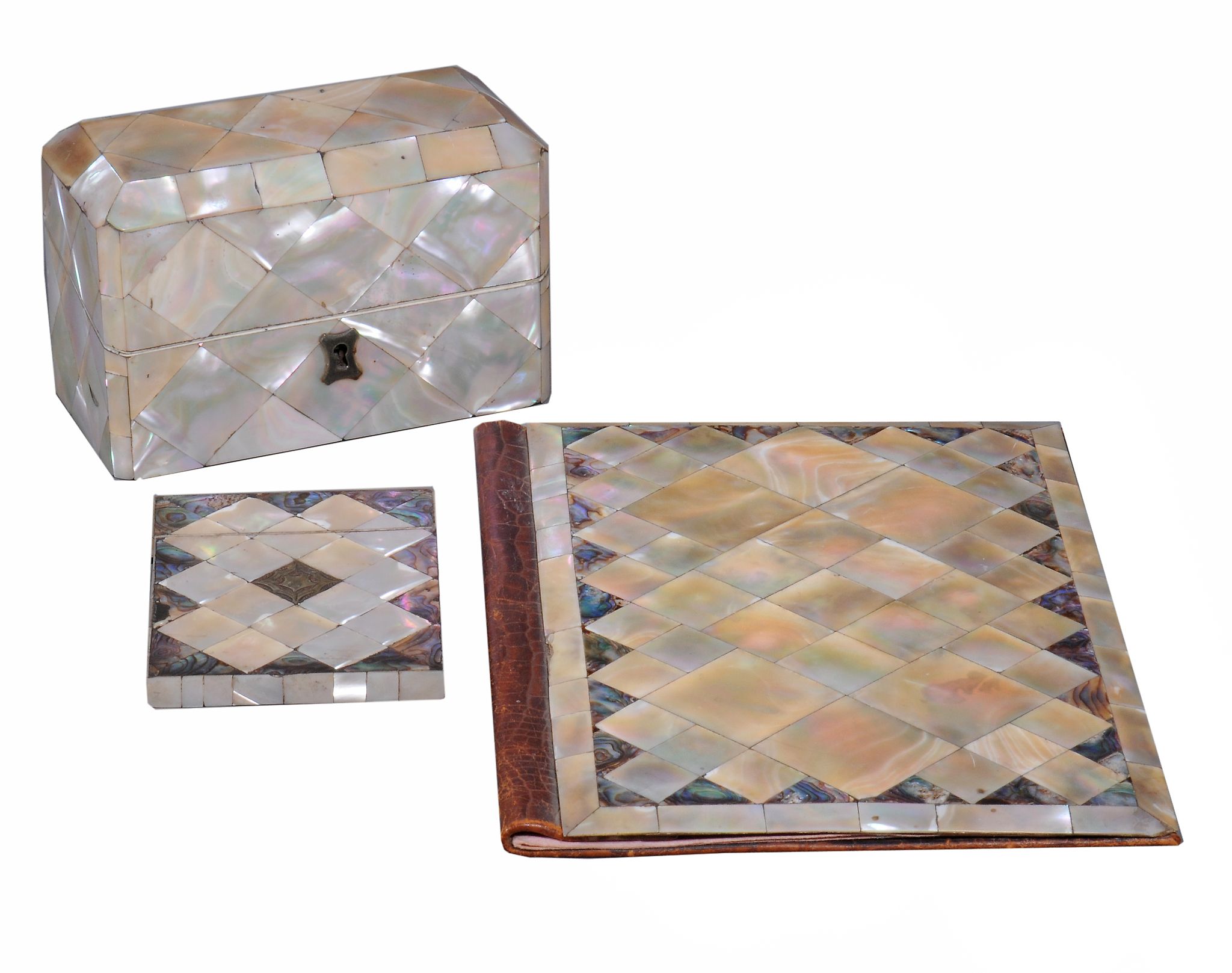 A rectangular mother of pearl perfumiere box,   circa 1870, lozenge veneered and containing three