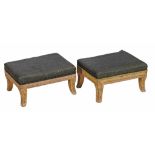 A pair of Regency cream painted footstools  , circa 1815,  with padded tops, on sabre legs painted