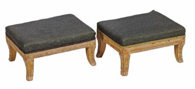 A pair of Regency cream painted footstools  , circa 1815,  with padded tops, on sabre legs painted