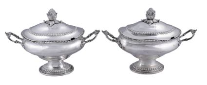 A pair of early George III silver oval pedestal sauce tureens and covers by Francis Butty  &