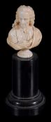 An ivory bust of Voltaire,   early 19th century,  on ebonised plinth , 7.5cm high