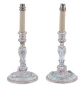 A pair of Dresden rococo style candlesticks  , late 19th century,  crossed swords marks in