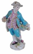 A Meissen (outside decorated) figure of a young man  , late 19th century,  holding a posy in one