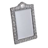 An Edwardian silver shaped rectangular dressing table mirror,   maker's mark  L   (not traced),