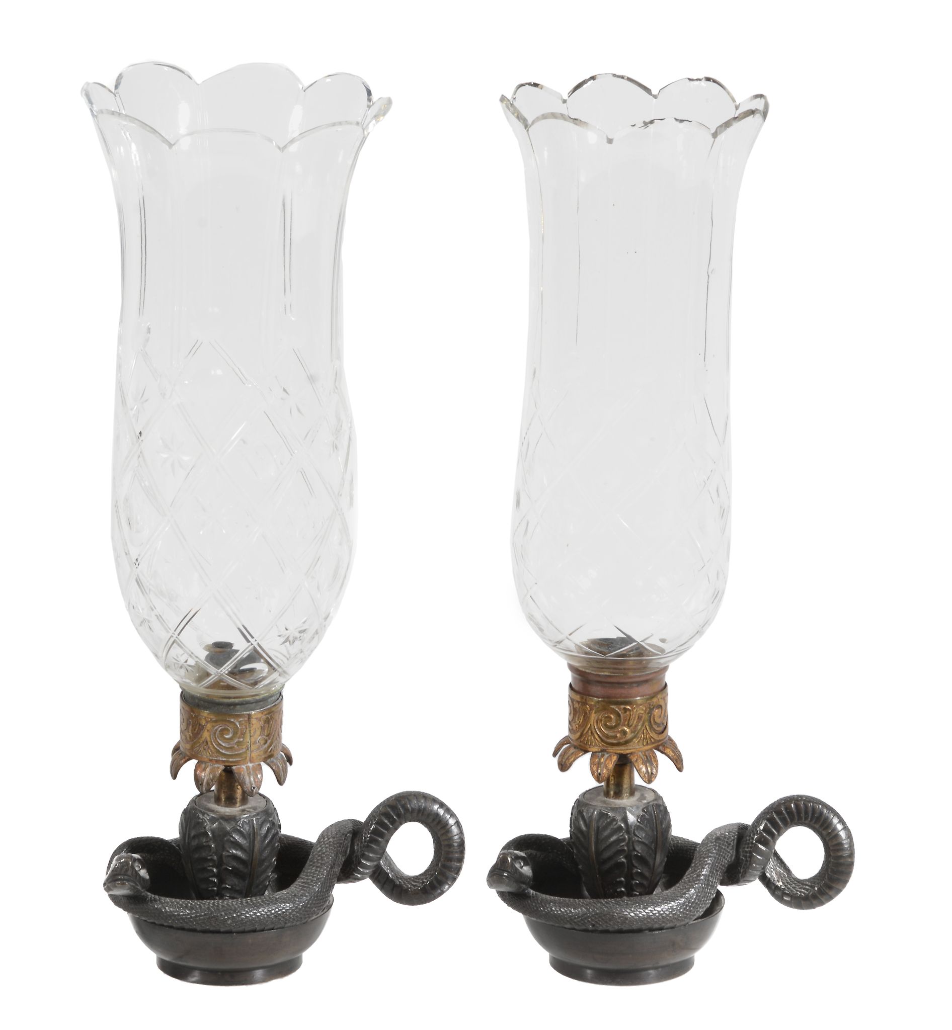 A pair of bronze and ormolu hurricane lamps  , first half 19th century, the glass chimneys above