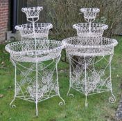 A pair of wirework garden plant stands  , 20th century, with three graduated tiers above base and