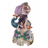 A Derby figure of Neptune  , circa 1820,  standing on a shell with a dolphin, the base encrusted