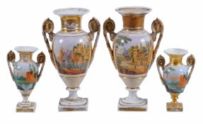 A pair of Paris porcelain vases  , circa 1840,  set with gilt mask handles, the sides painted with