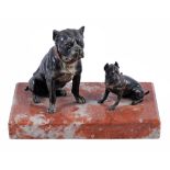 An Austrian cold-painted bronze group of a bulldog and chihuahua, circa 1900,  on a red marble base,