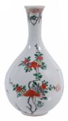 A famille-verte bottle vase,   Qing dynasty, Kangxi, (1662-1722) painted with flowering branches on